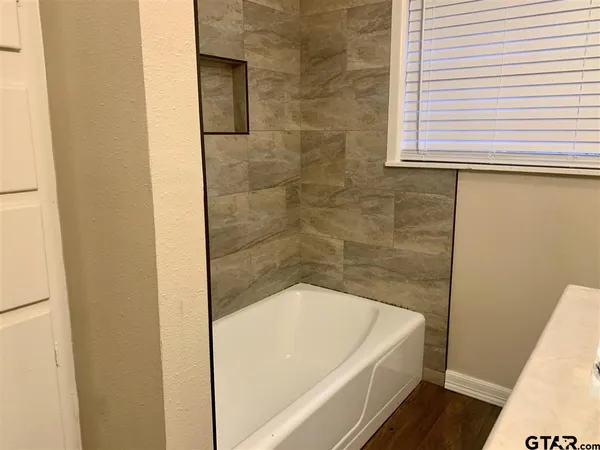 a bathroom with a bathtub