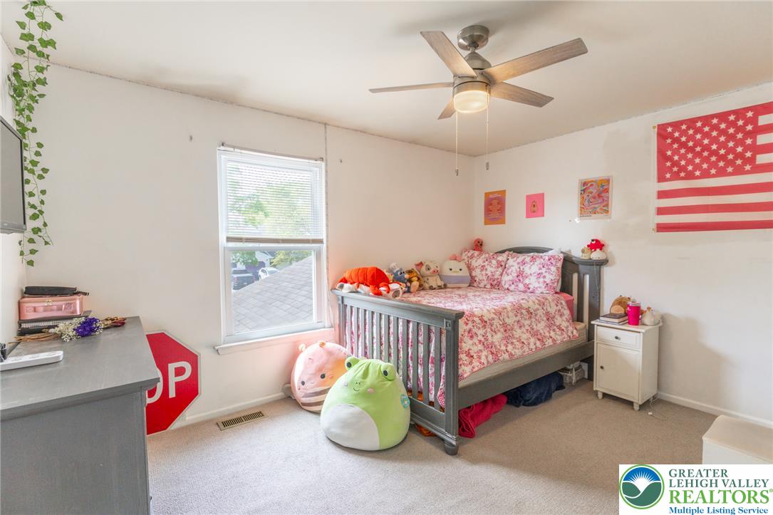 896 Briarstone Road Bethlehem, PA 18017 - Photo 14 of 26 a bedroom with furniture and a bed