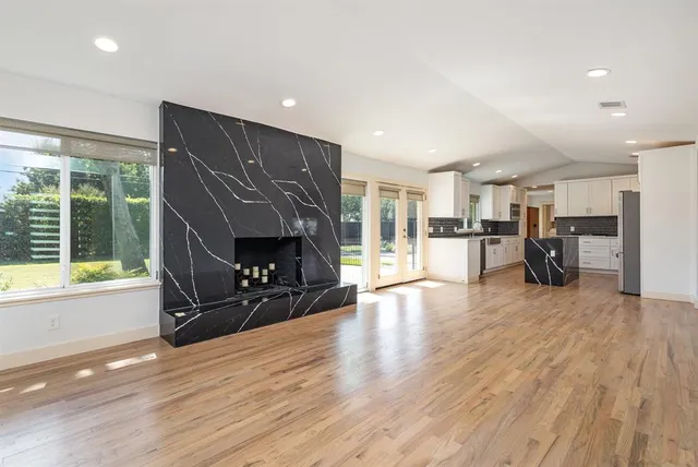 a view of a livingroom with furniture and a fireplace