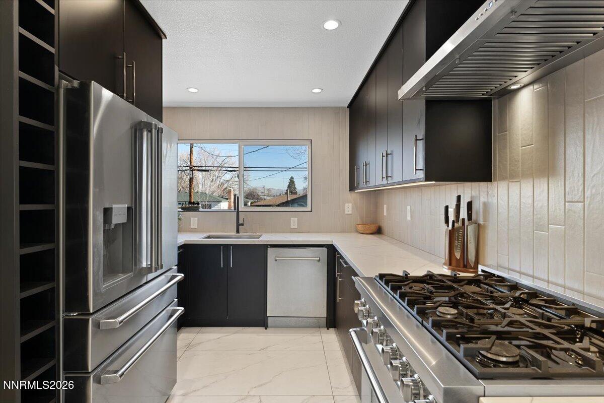 736 Yori Avenue Reno, NV 89502 - Photo 13 of 35 a kitchen with a stove and a refrigerator