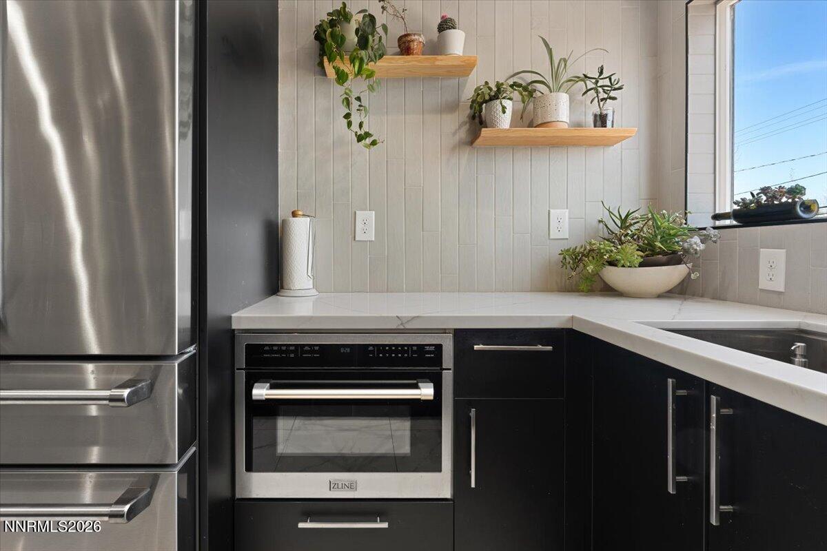 736 Yori Avenue Reno, NV 89502 - Photo 15 of 35 a kitchen with a sink and a refrigerator