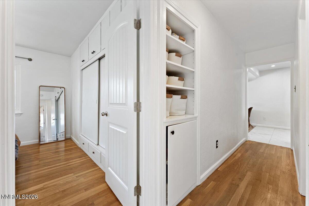 736 Yori Avenue Reno, NV 89502 - Photo 16 of 35 a view of a hallway with wooden floor and staircase