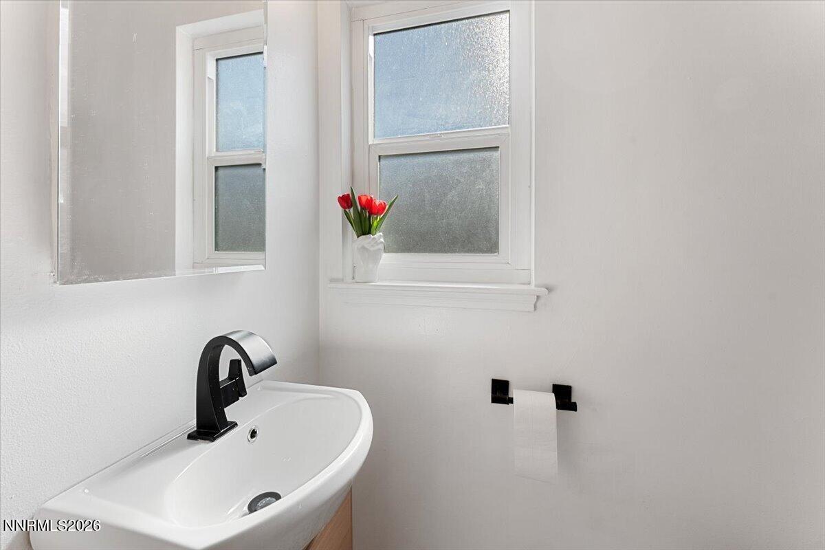 736 Yori Avenue Reno, NV 89502 - Photo 20 of 35 a bathroom with a sink and a mirror