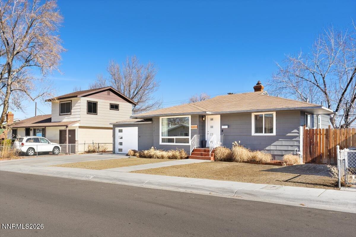 736 Yori Avenue Reno, NV 89502 - Photo 2 of 35 a front view of a house with a yard