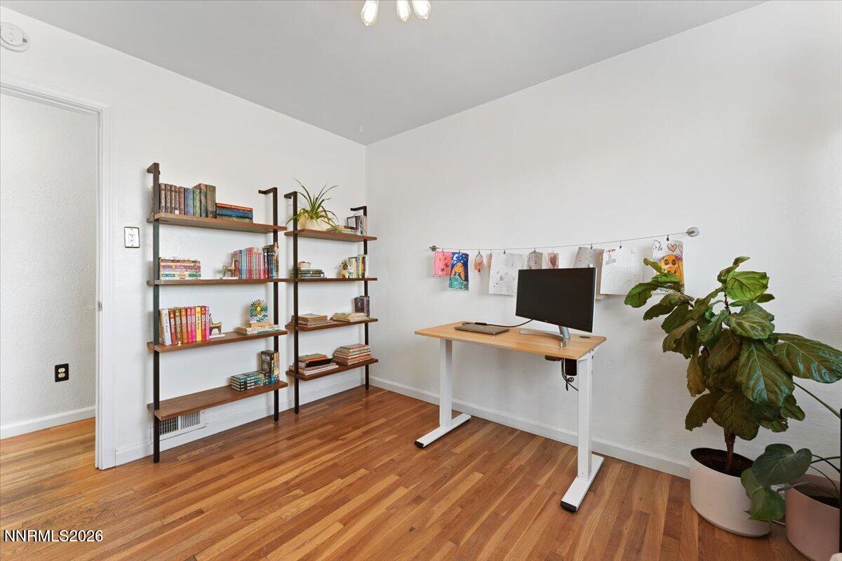 736 Yori Avenue Reno, NV 89502 - Photo 23 of 35 a view of a workspace with furniture and wooden floor