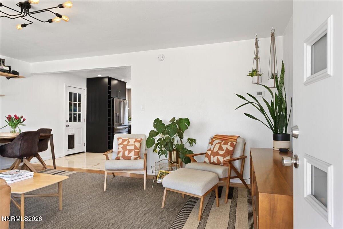 736 Yori Avenue Reno, NV 89502 - Photo 3 of 35 a dining room with furniture potted plants and wooden floor