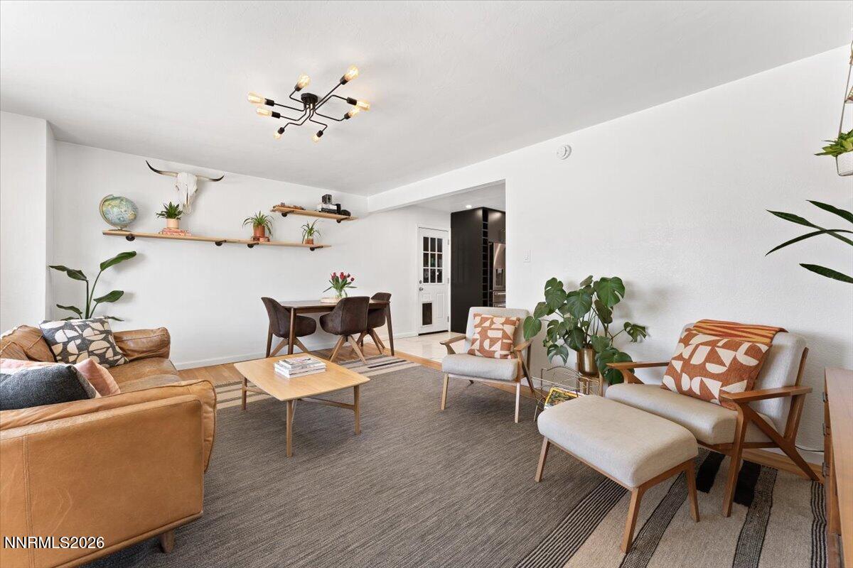 736 Yori Avenue Reno, NV 89502 - Photo 4 of 35 a living room with furniture and a chandelier