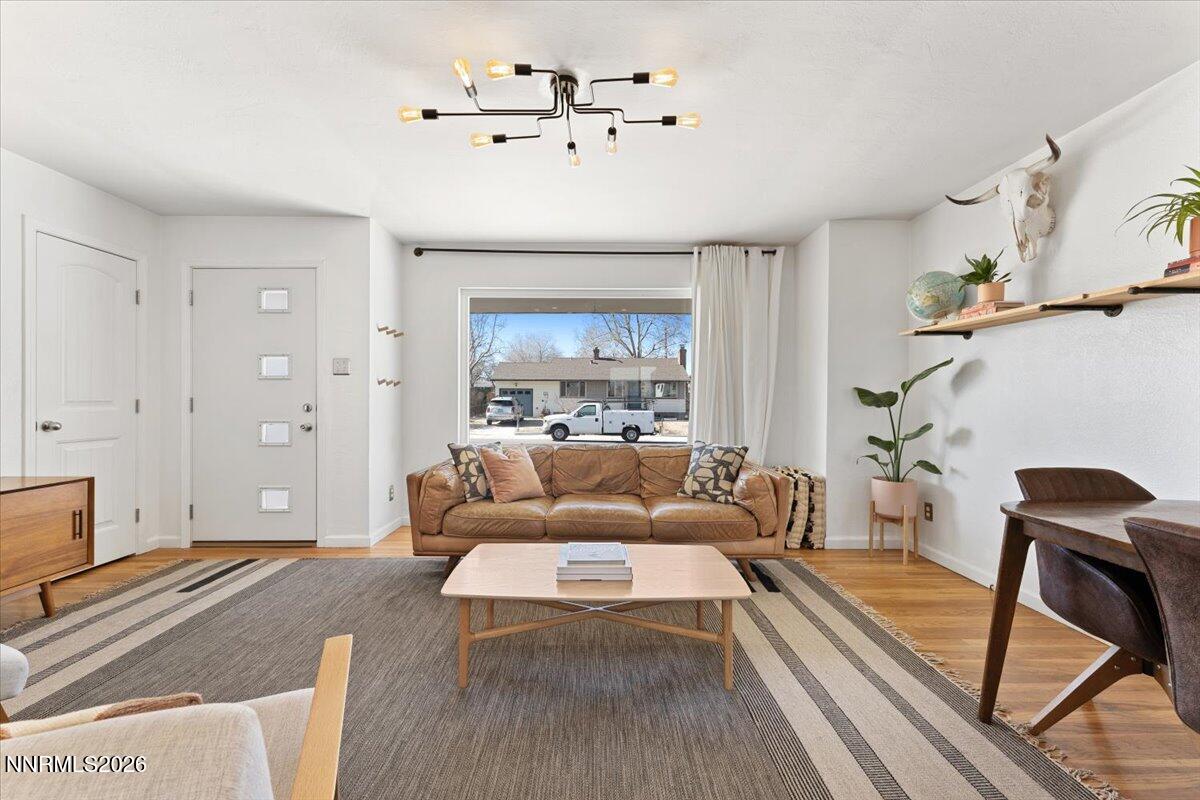736 Yori Avenue Reno, NV 89502 - Photo 6 of 35 a living room with furniture and a chandelier