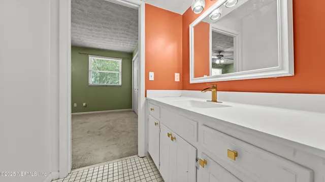 a bathroom with a sink and a mirror