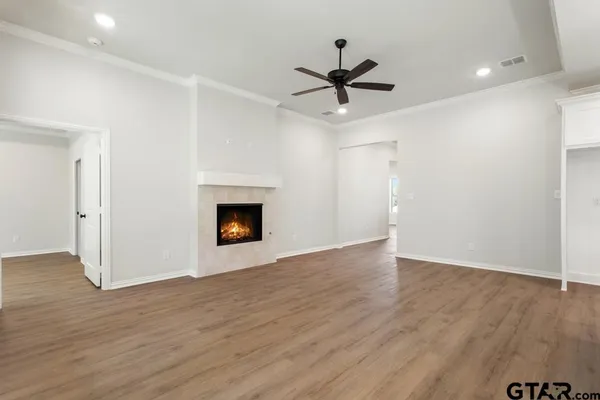 a view of kitchen with cabinets and wooden floor