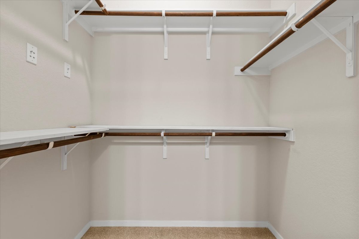 123 Saranac Drive Elgin, TX 78621 - Photo 19 of 27 The walk-in closet provides excellent storage and organization.