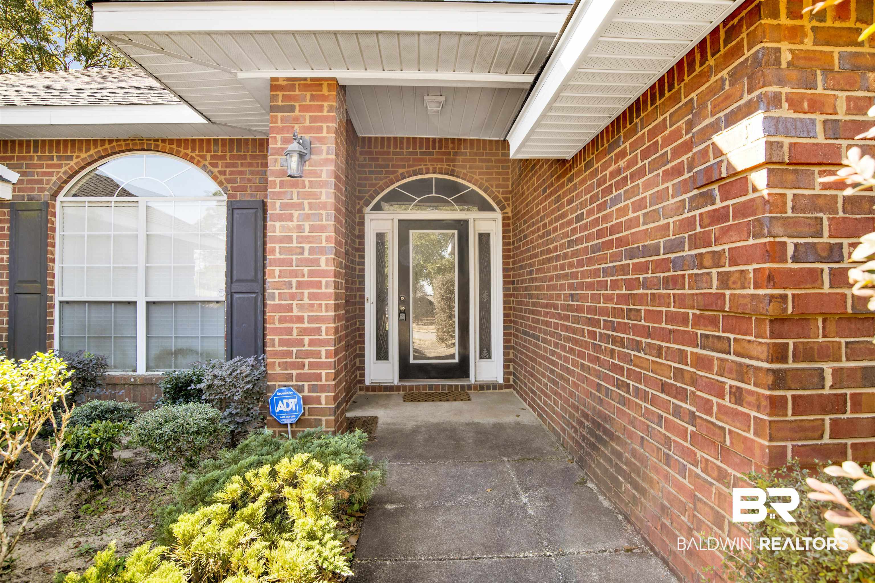 7297 Bridgemill Drive Mobile, AL 36619 - Photo 2 of 33 Property entrance featuring brick siding and covered porch