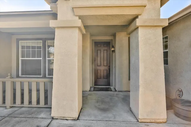 a view of a house with wooden walls