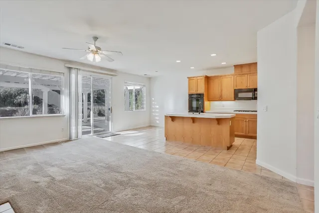 a kitchen with a sink appliances and cabinets