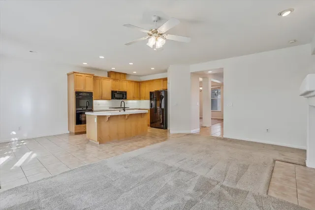 a view of kitchen with refrigerator and window