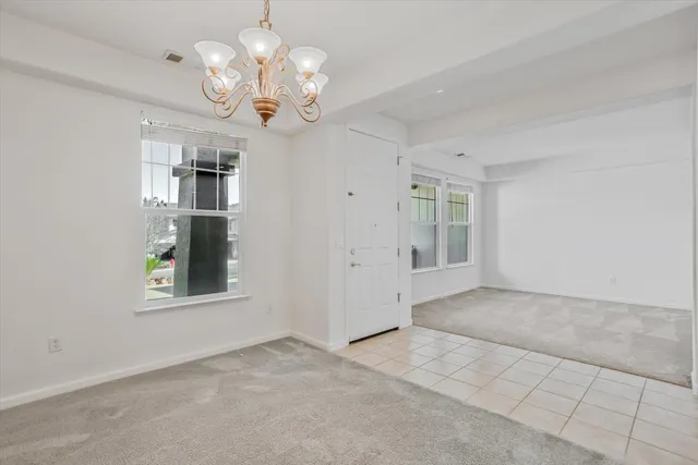 a kitchen with stainless steel appliances granite countertop a refrigerator a stove and a sink with wooden cabinets