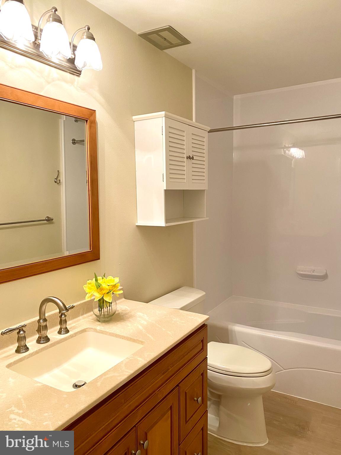 3408 Hallaton Court, Unit 165B Silver Spring, MD 20906 - Photo 23 of 40 UPDATED KOHLER COMMODE ,LUXURY VINYL TILE FLOOR