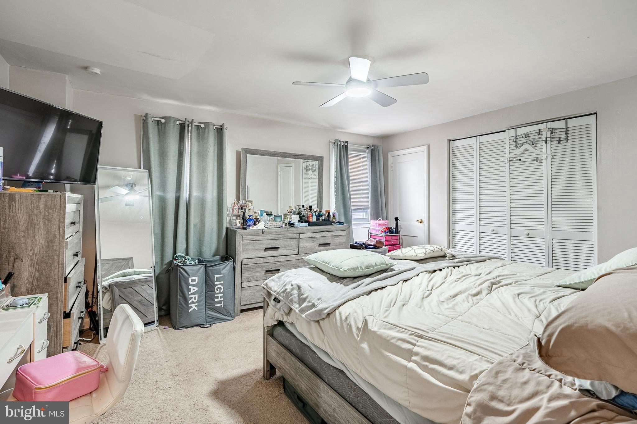 211 Wingate Road Upper Darby, PA 19082 - Photo 14 of 27 a bedroom with a bed and a chandelier