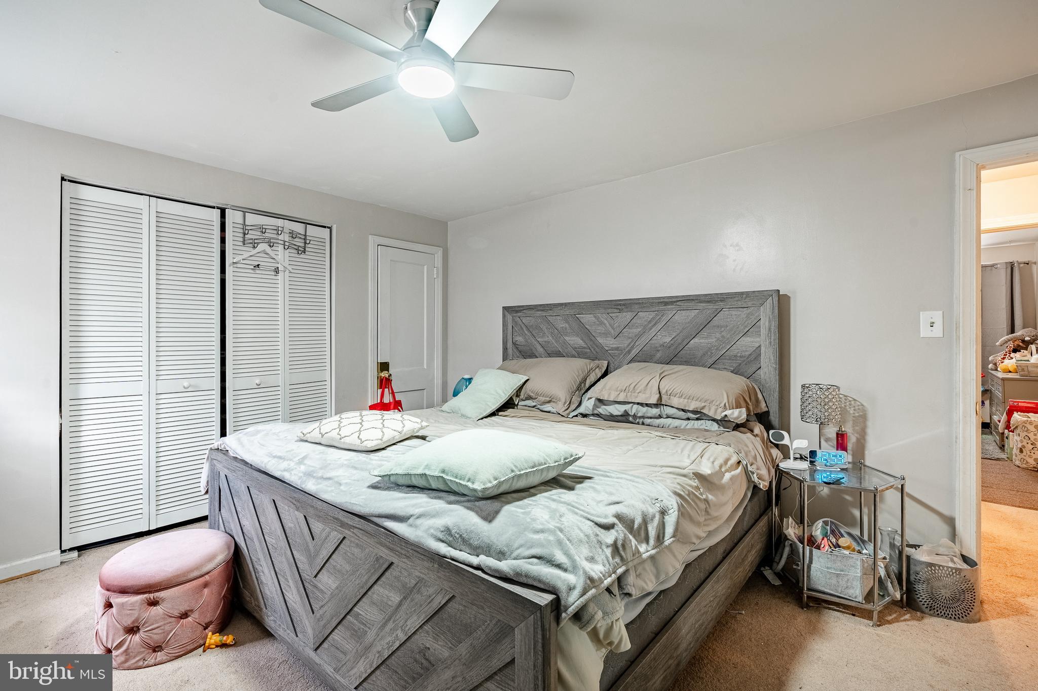 211 Wingate Road Upper Darby, PA 19082 - Photo 15 of 27 a bedroom with a bed and a chandelier