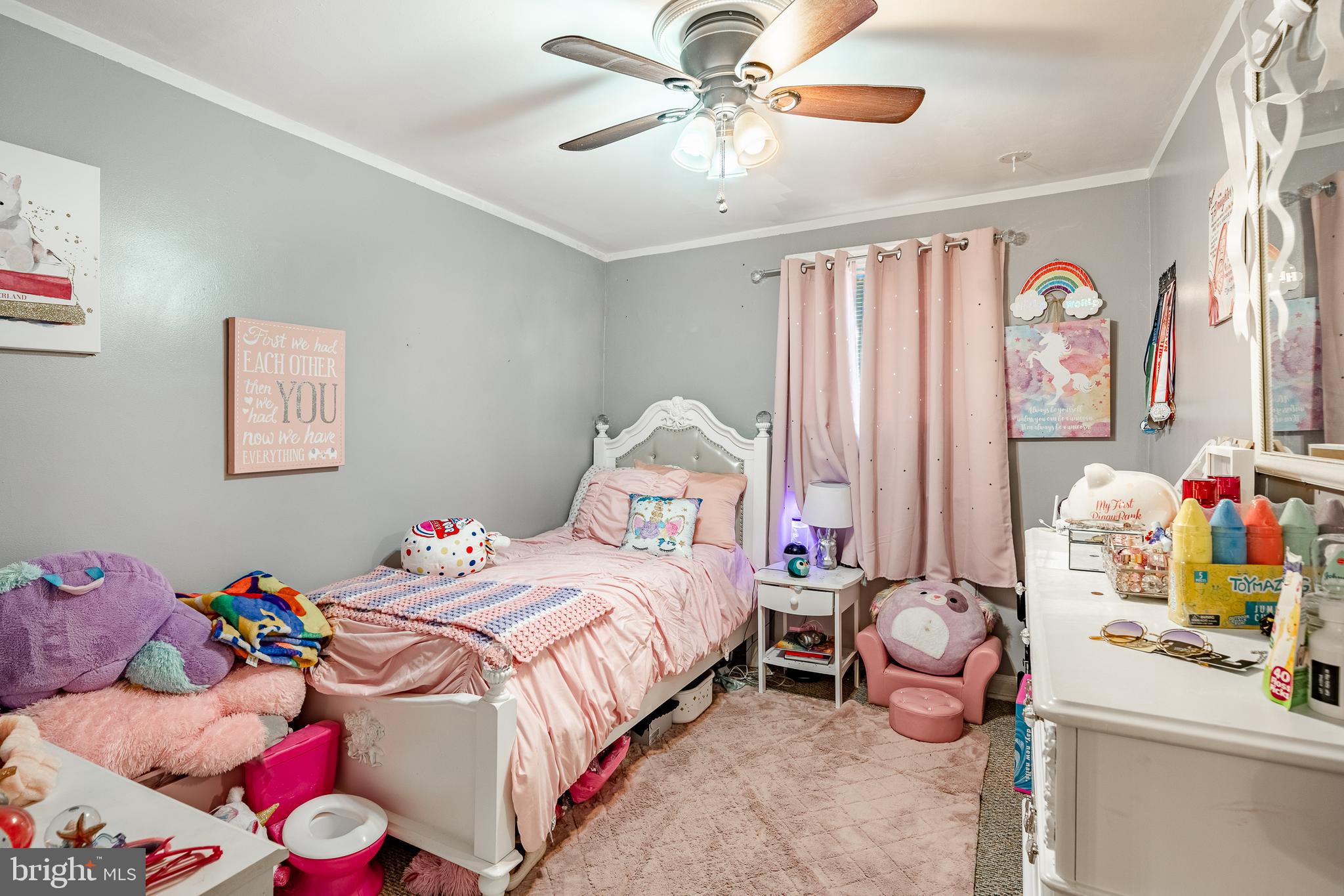211 Wingate Road Upper Darby, PA 19082 - Photo 16 of 27 a bedroom with a bed and a chandelier