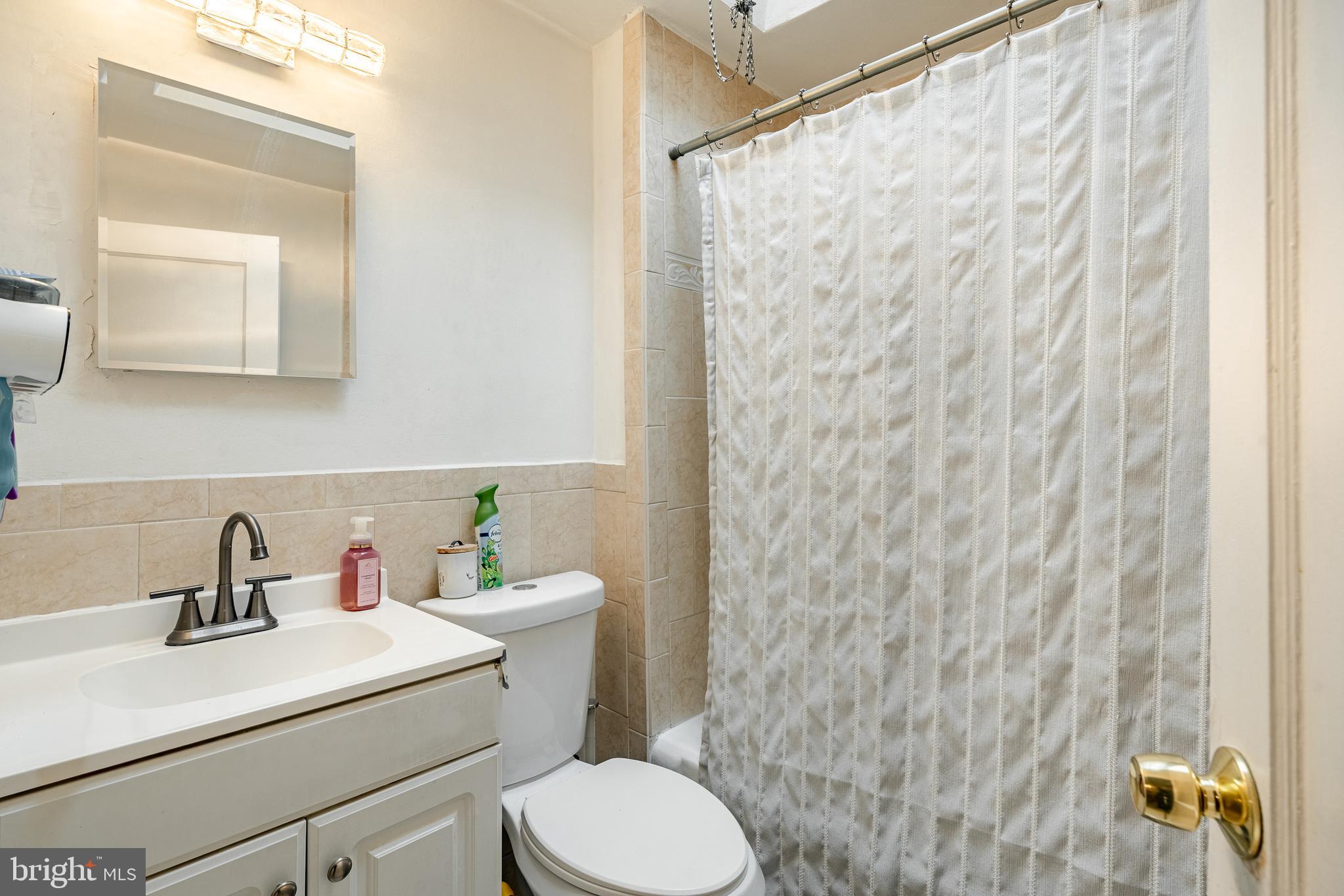 211 Wingate Road Upper Darby, PA 19082 - Photo 19 of 27 a bathroom with a sink and a mirror