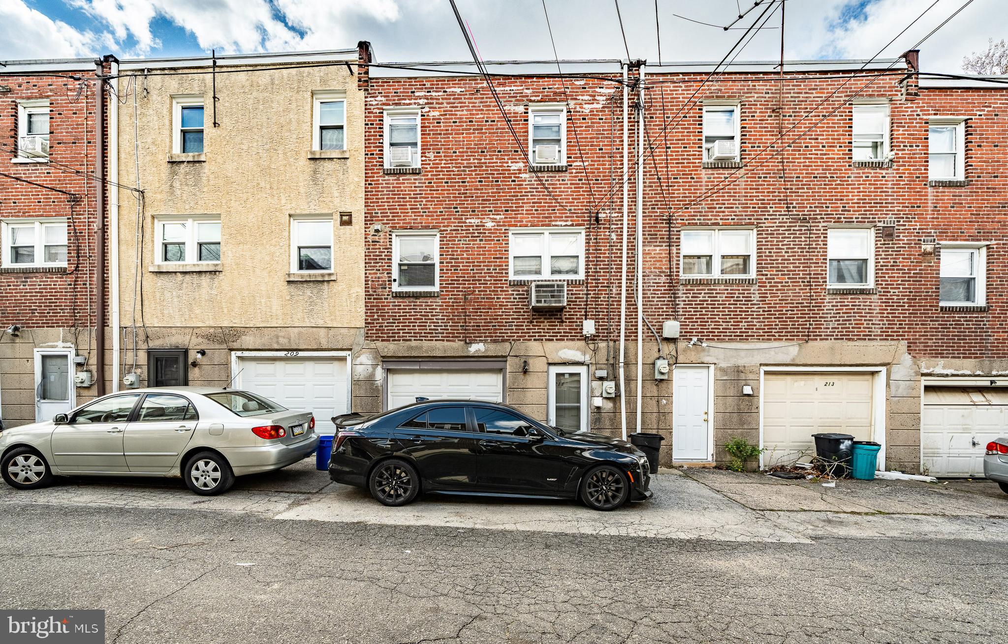 211 Wingate Road Upper Darby, PA 19082 - Photo 27 of 27 a view of a car parked in front of a building