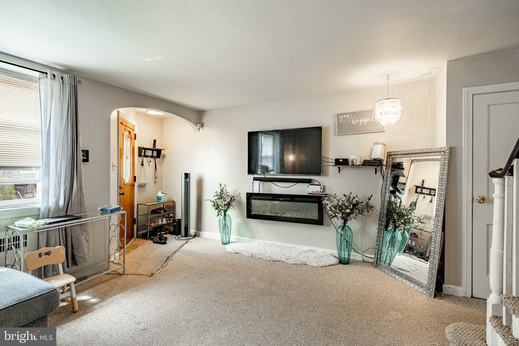 211 Wingate Road Upper Darby, PA 19082 - Photo 9 of 27 a view of a livingroom with furniture and a flat screen tv
