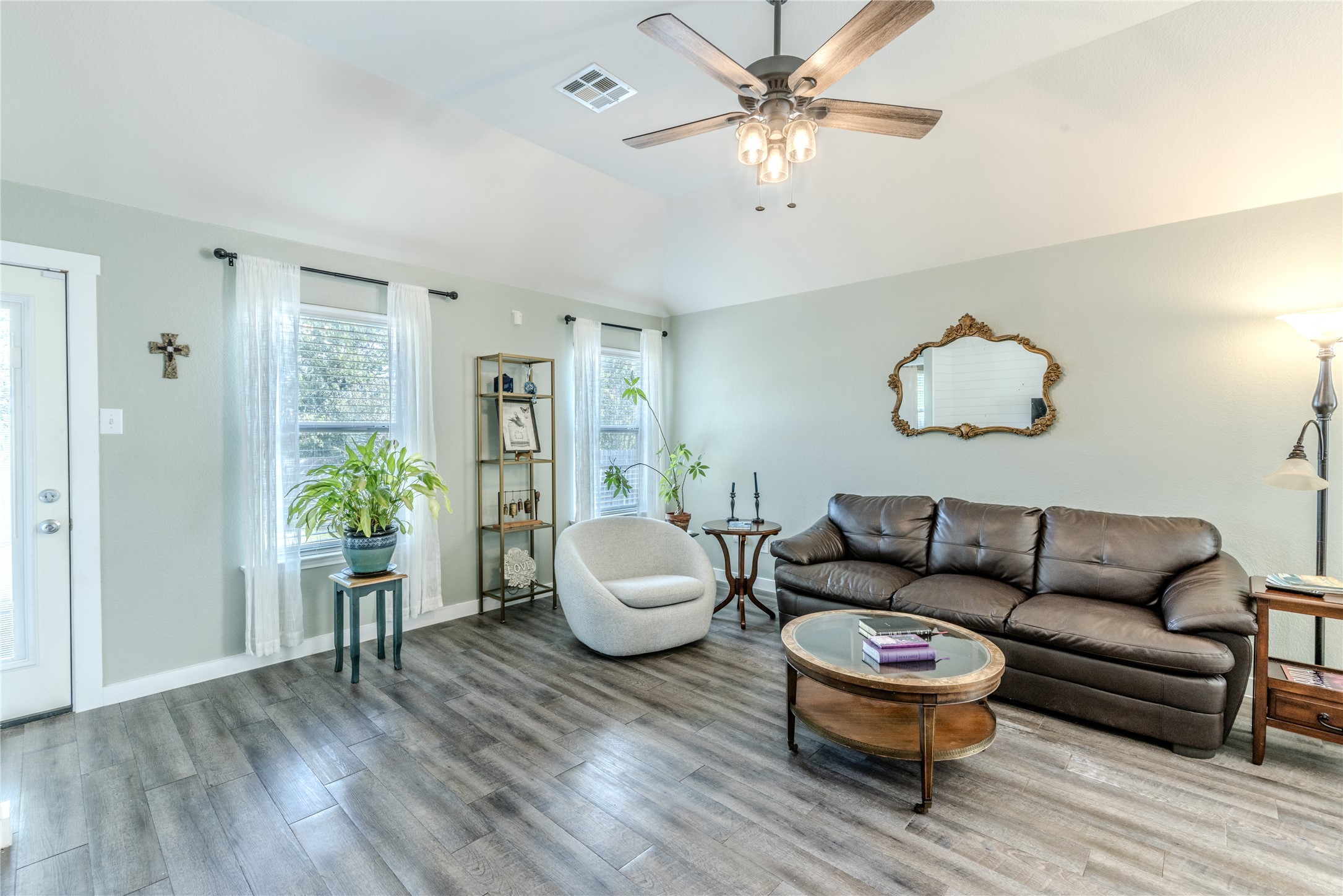 1089 Hot Spring Valley Buda, TX 78610 - Photo 3 of 26 Hardwood floors and high ceilings complete this inviting living area.