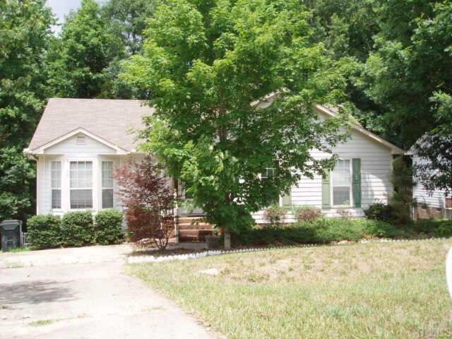 4441 Labrador Drive Raleigh, NC 27616 - Photo 1 of 3 a view of a house with a yard and large tree
