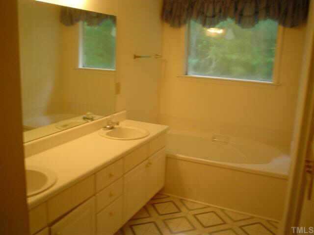 4441 Labrador Drive Raleigh, NC 27616 - Photo 2 of 3 a bathroom with a sink and a shower