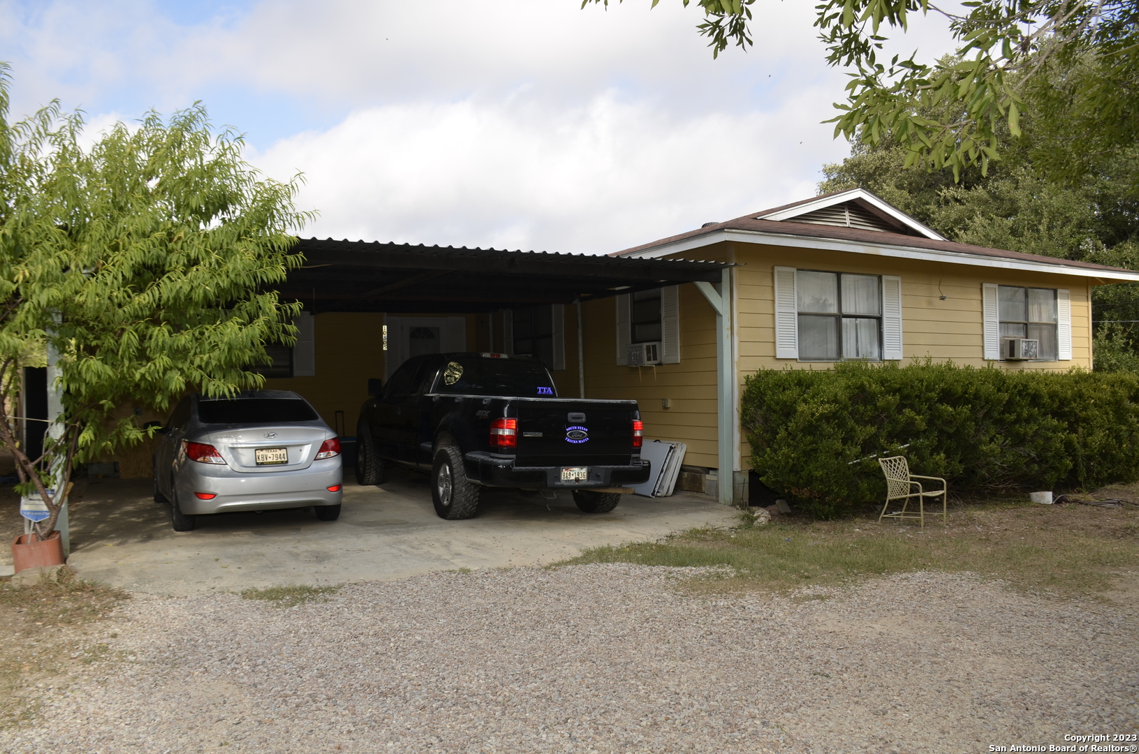 10805 Hollowell Road Atascosa, TX 78002 - Photo 1 of 25 a view of a car parked in front of a house
