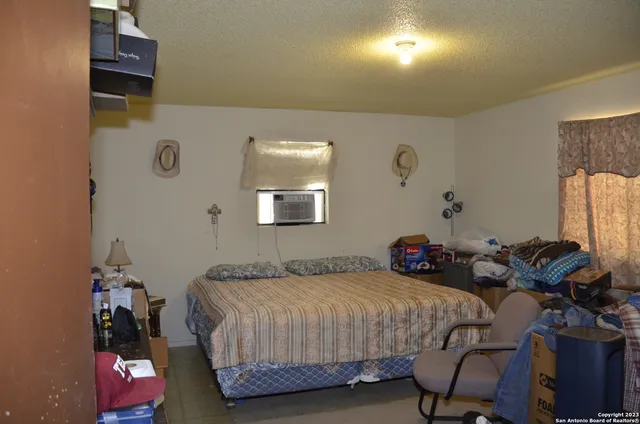 a bedroom with bed and a closet