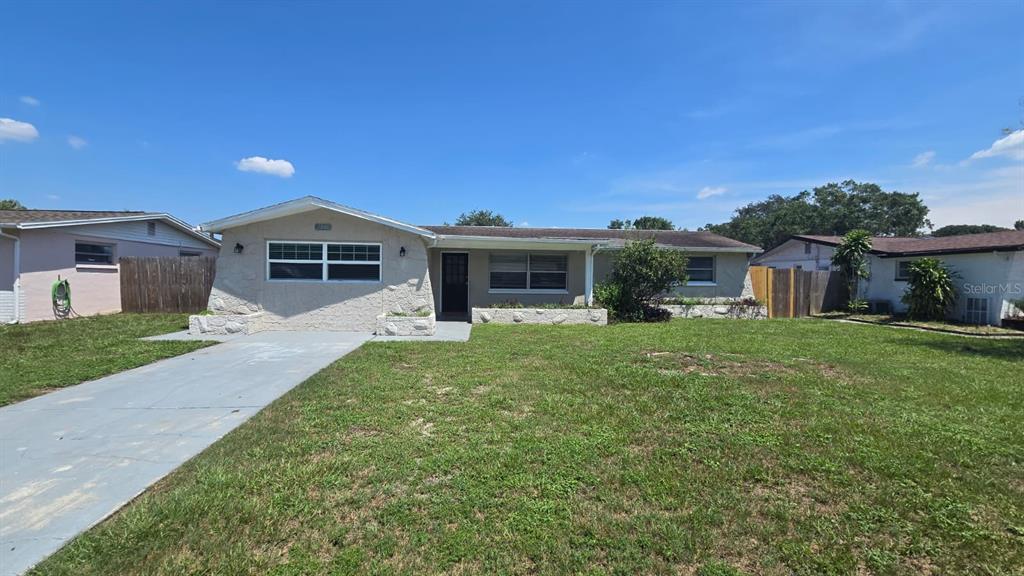 a front view of a house with a garden and porch
