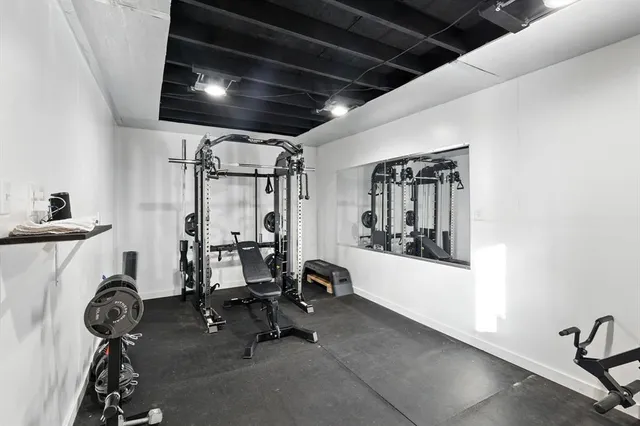 a bathroom with a double vanity sink a shower and a mirror