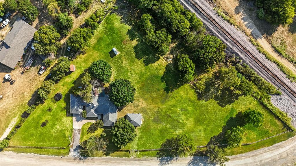 11005 Cowboy Lane Flower Mound, TX 76262 - Photo 3 of 14 a view of a yard