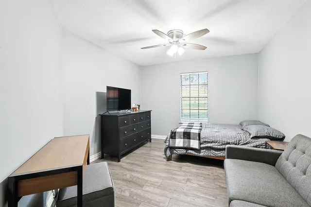 a kitchen with a dining table chairs and microwave