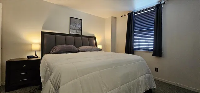 a bedroom with a bed and a closet