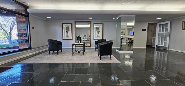 a view of a livingroom with furniture and windows