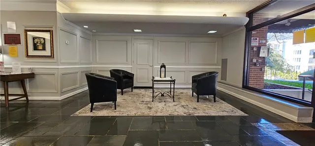 a view of a dining room with furniture and window