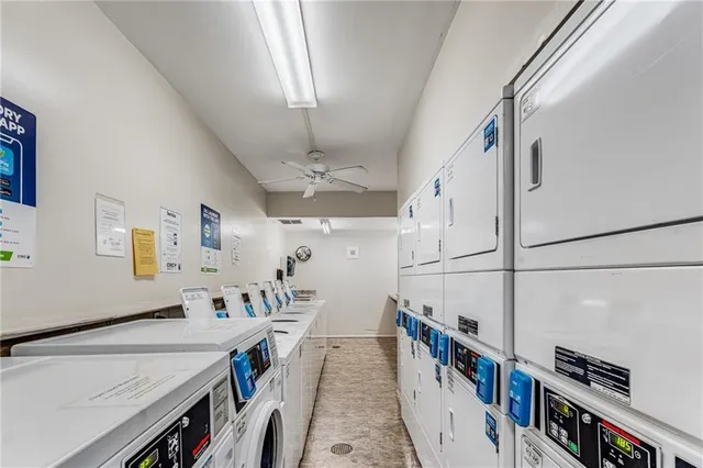 a view of a livingroom with furniture and stairs