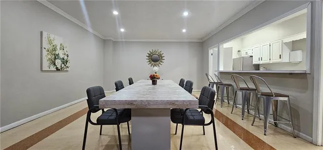 a view of a a dining room with furniture window and wooden floor
