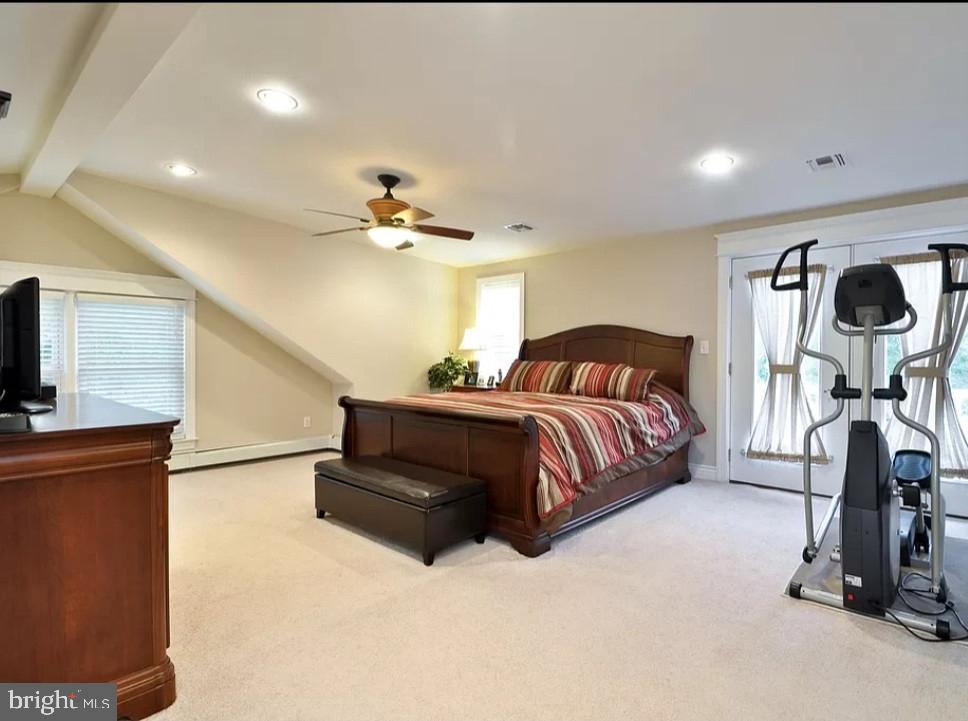 643 Etra Road East Windsor, NJ 08520 - Photo 19 of 26 a bedroom with a bed and a chandelier