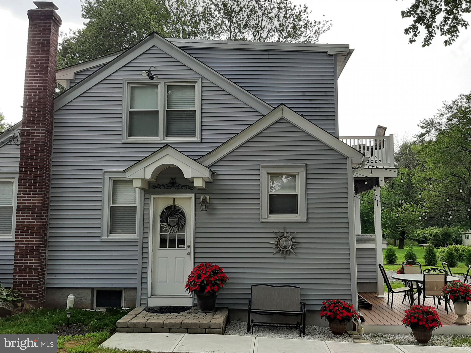 643 Etra Road East Windsor, NJ 08520 - Photo 2 of 26 a front view of a house with plants