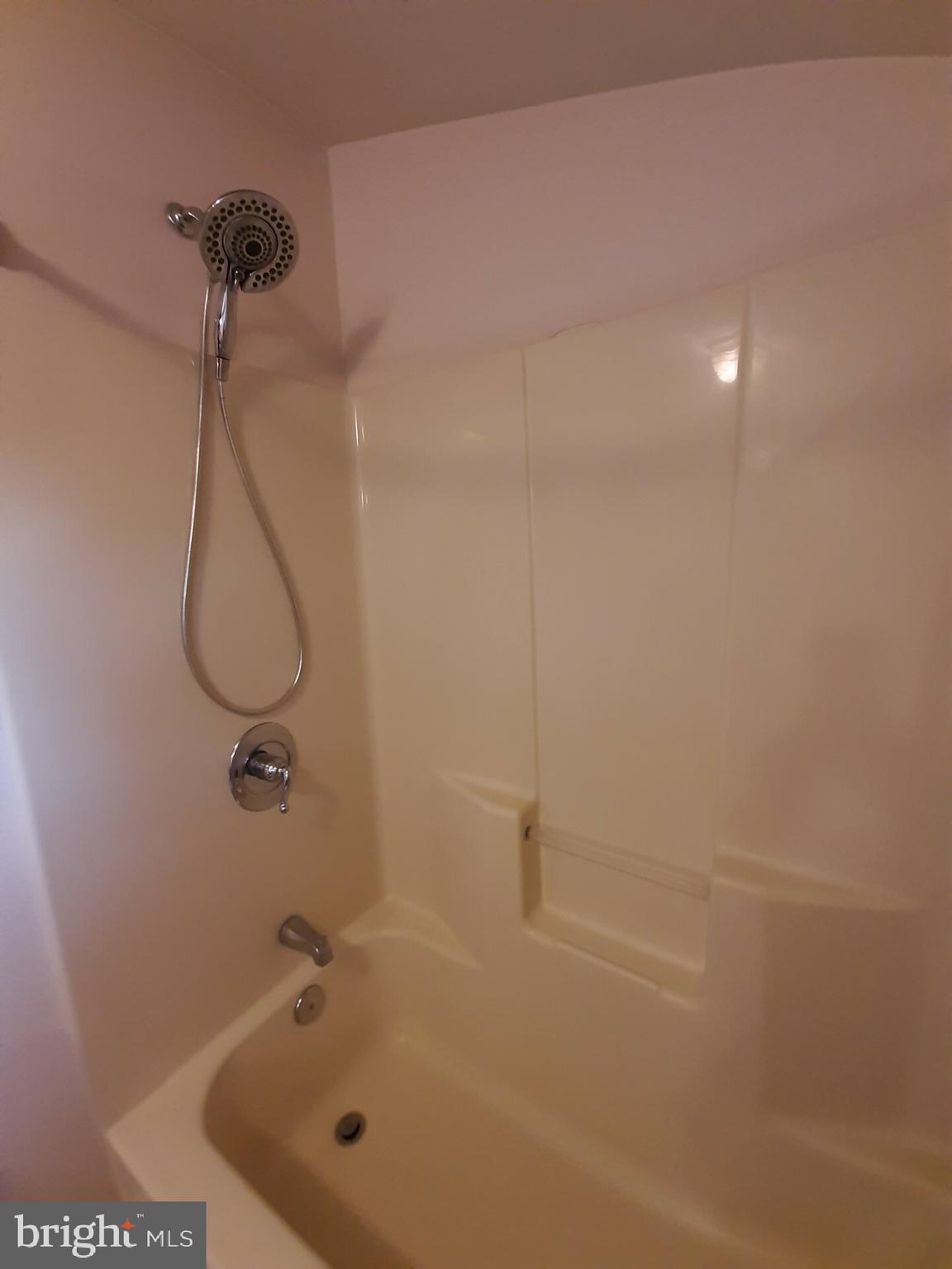 643 Etra Road East Windsor, NJ 08520 - Photo 23 of 26 a bathroom with a bath tub with a shower