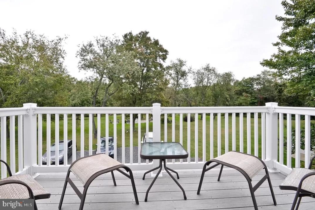 643 Etra Road East Windsor, NJ 08520 - Photo 24 of 26 a balcony with table and chairs