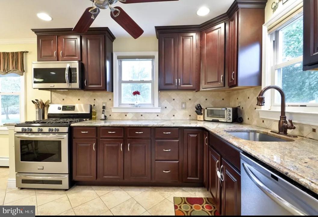 643 Etra Road East Windsor, NJ 08520 - Photo 3 of 26 a kitchen with a sink cabinets and window