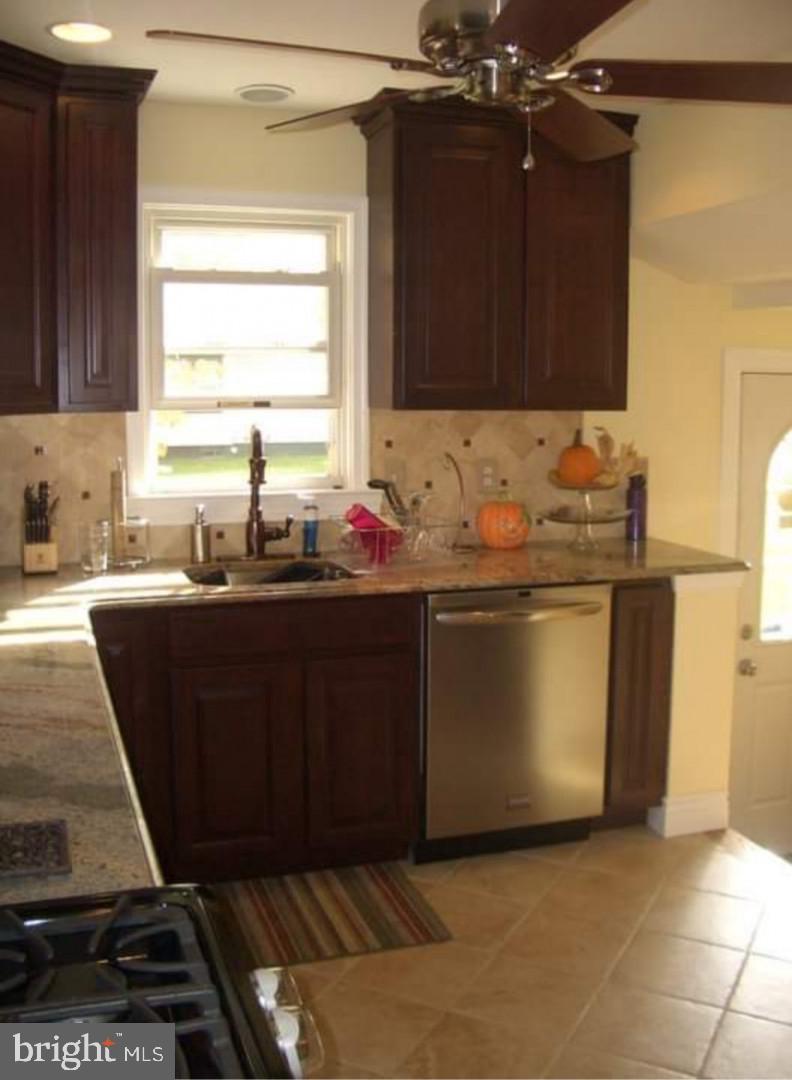 643 Etra Road East Windsor, NJ 08520 - Photo 6 of 26 a kitchen with a sink and a stove top oven