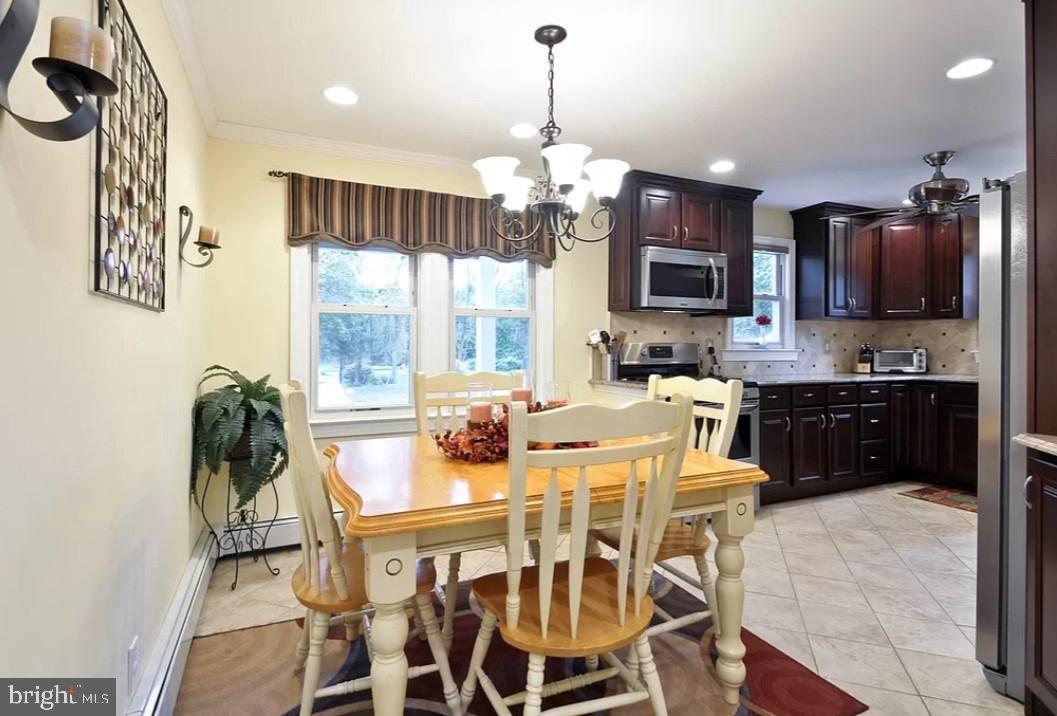 643 Etra Road East Windsor, NJ 08520 - Photo 9 of 26 a view of a dining room with furniture window and outside view