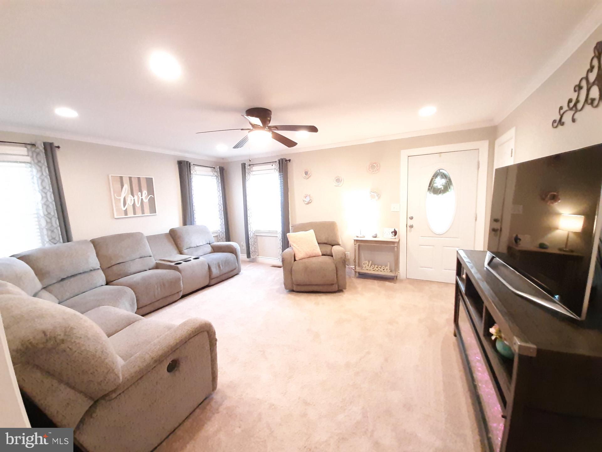 643 Etra Road East Windsor, NJ 08520 - Photo 10 of 26 a living room with furniture and a flat screen tv