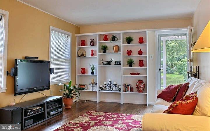 54 Ridge Road, Unit B Greenbelt, MD 20770 - Photo 3 of 9 a living room with furniture and a flat screen tv